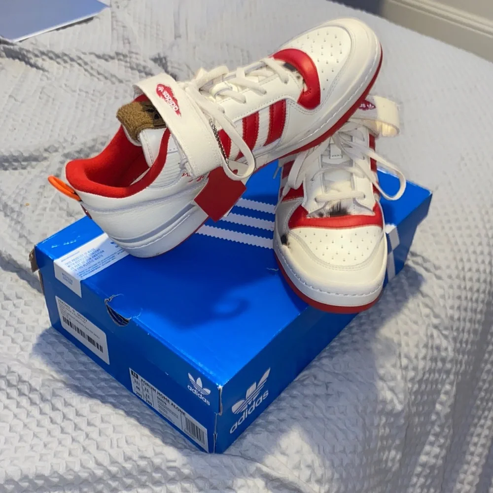 a pair of NMD ADDIDAS exclusive home alone collab - Picture 1 of 4
